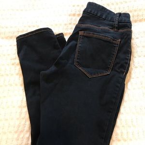 Dark blue stretch denim skinny jeans.